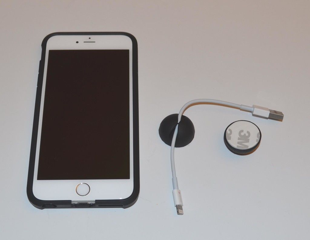 A sample view of the CableButton in use and size comparison with the Apple iPhone 6 Plus.