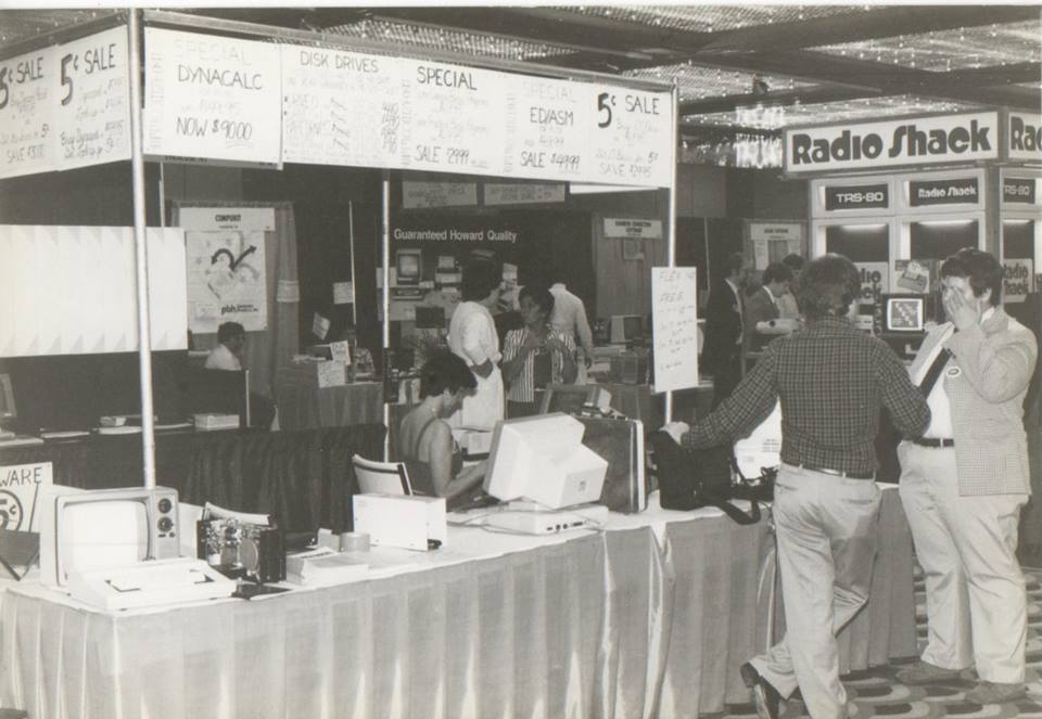 Another booth. According to Frank Hogg, "Carol Sprague in the booth, Bob Phillips from GMX talking to Rich Hogg."