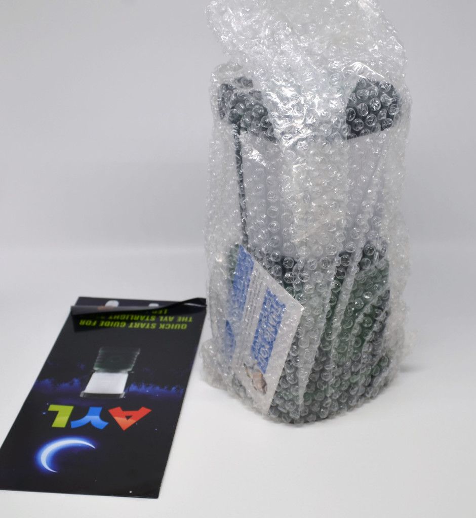AYL StarLight 330 LED camping lantern packaging contents, a manual and the lantern.