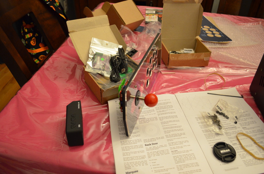 The next step was attaching the joystick. I just removed the ball top and plastic disc, then inserted it through the hole. I secured it with two of the longer screws.