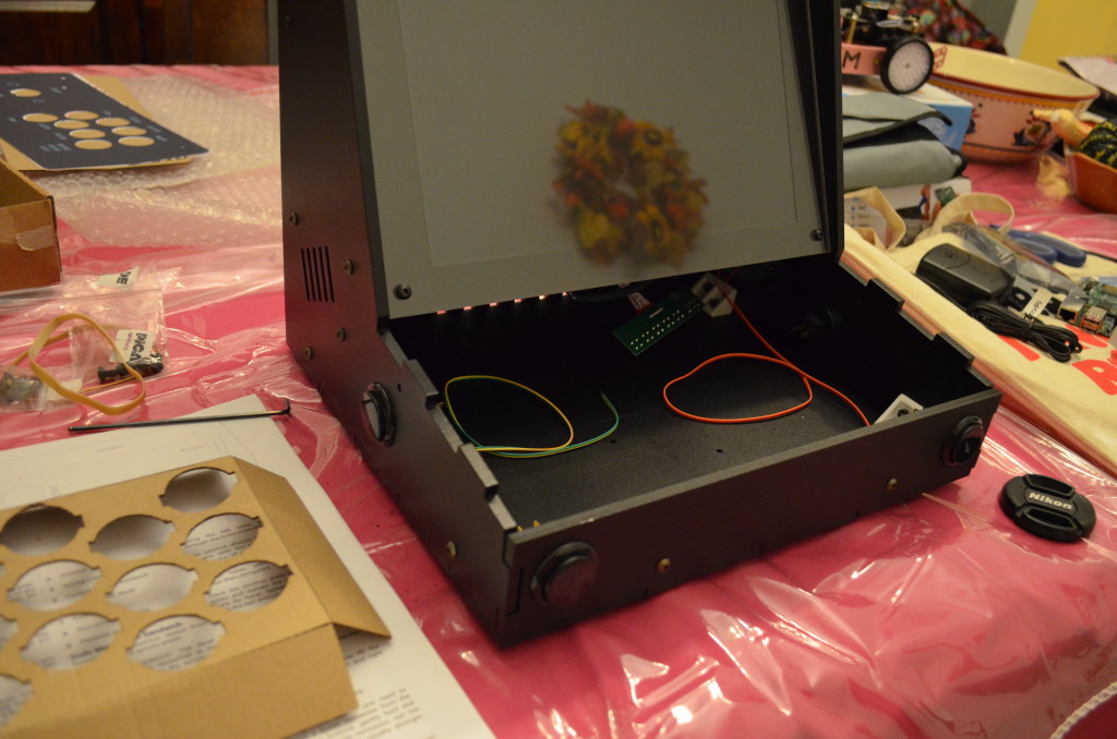 The remaining buttons in the kit went directly on the cabinet.