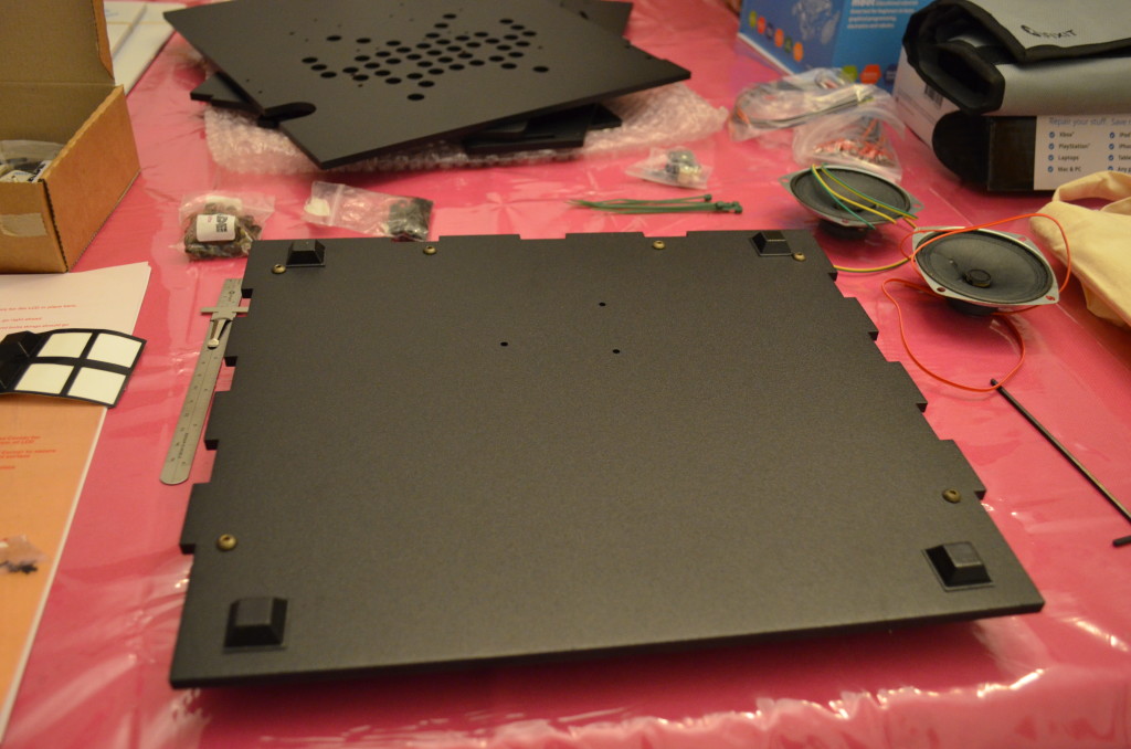 Attaching the rubber feet. This part you kind of wing with general guidelines from the manual.