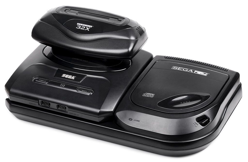 Sega Genesis Model 2, Sega CD 2, and Sega 32X. No one wants this scenario again. Image courtesy of: By Evan-Amos - Own work, Public Domain, https://commons.wikimedia.org/w/index.php?curid=14303771