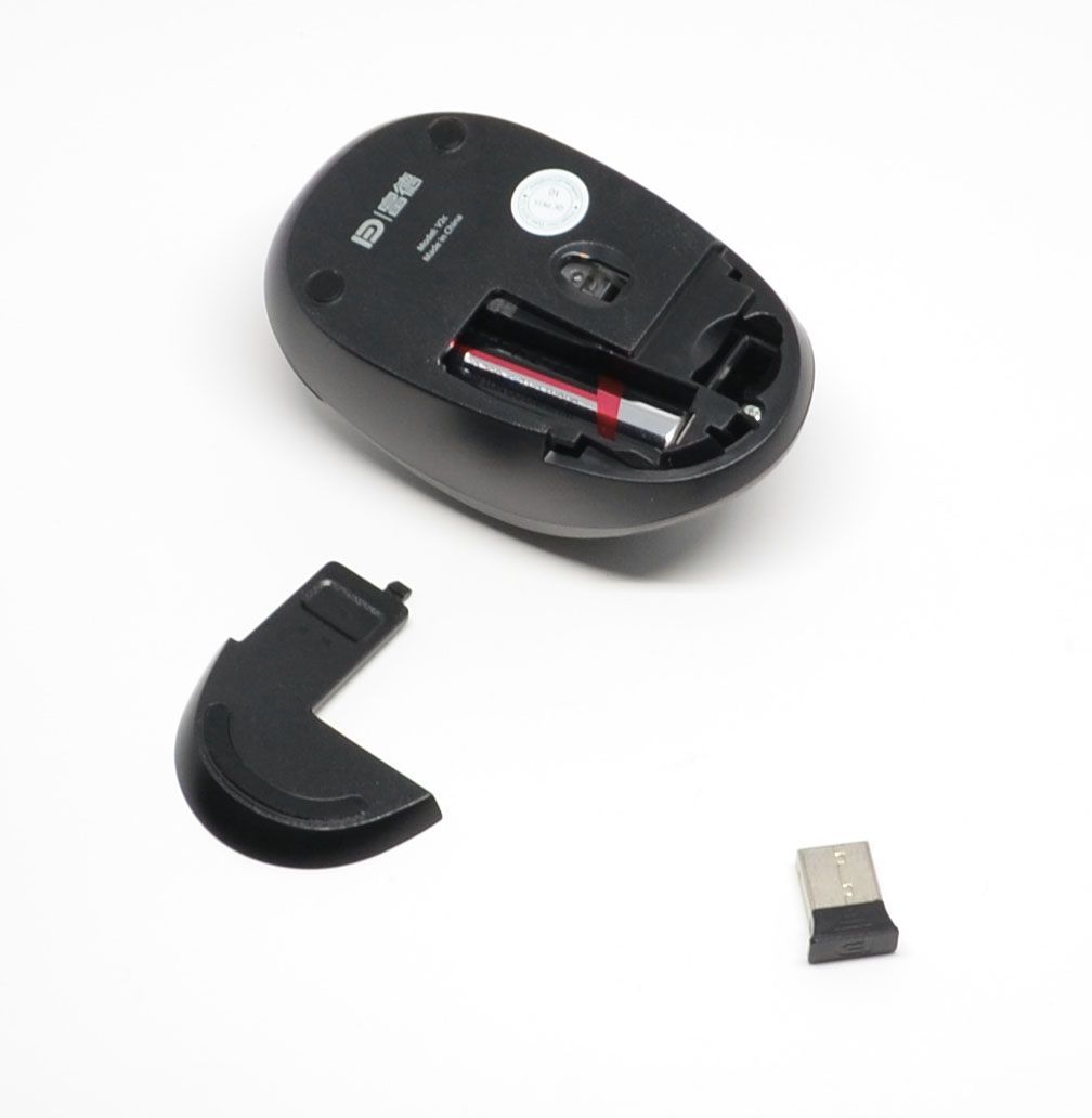 It takes one AAA battery and also has a compartment for the required USB dongle.
