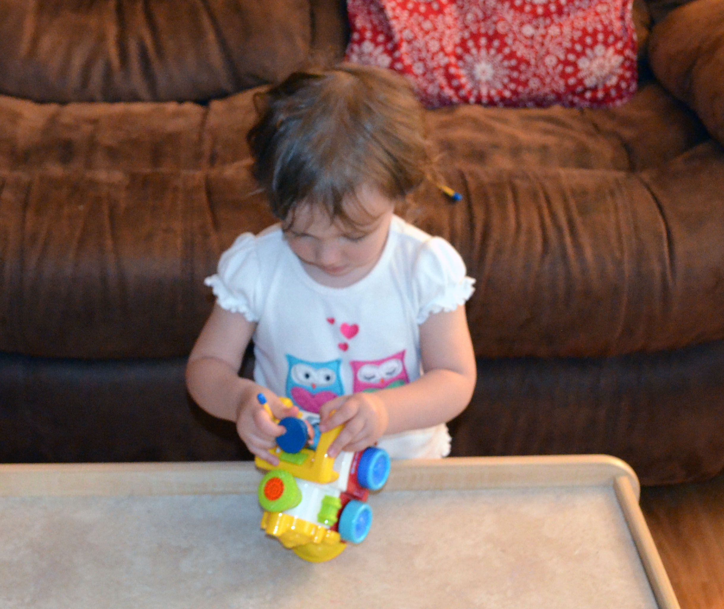 My daughter making the conductor do his job facing backwards.