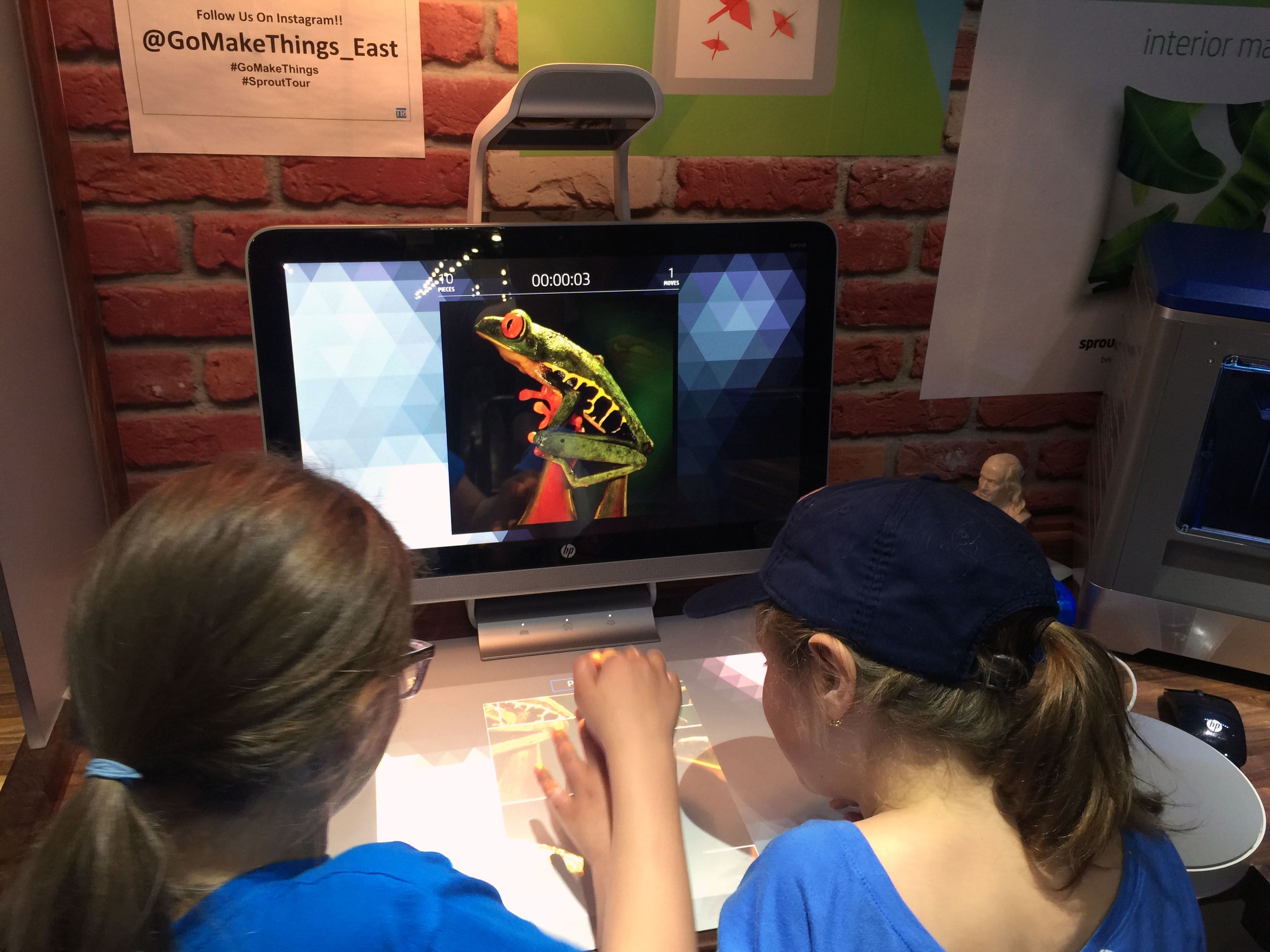 The girls fighting over one of the workstations.