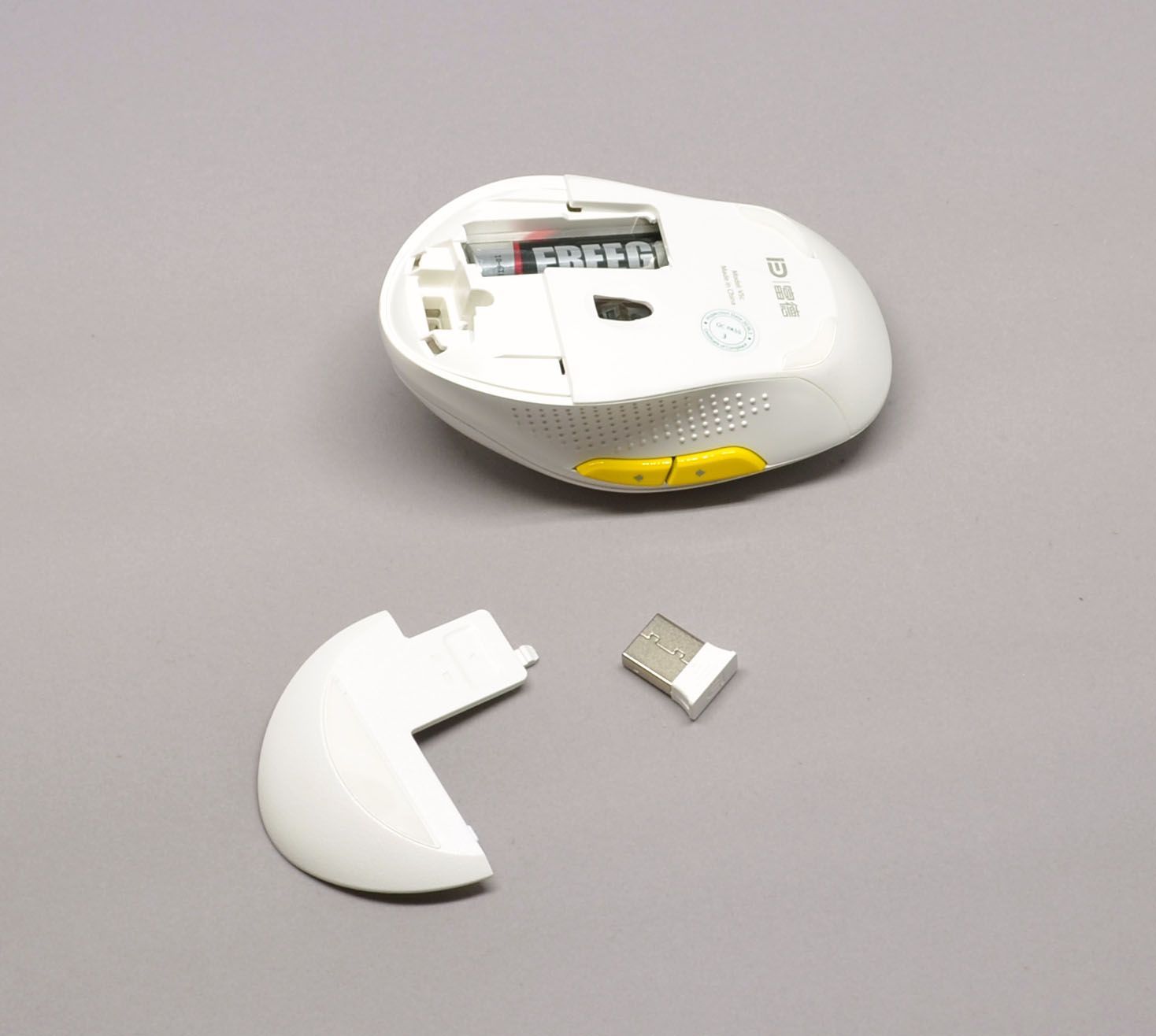 The dongle and included battery are found behind the rear cover.