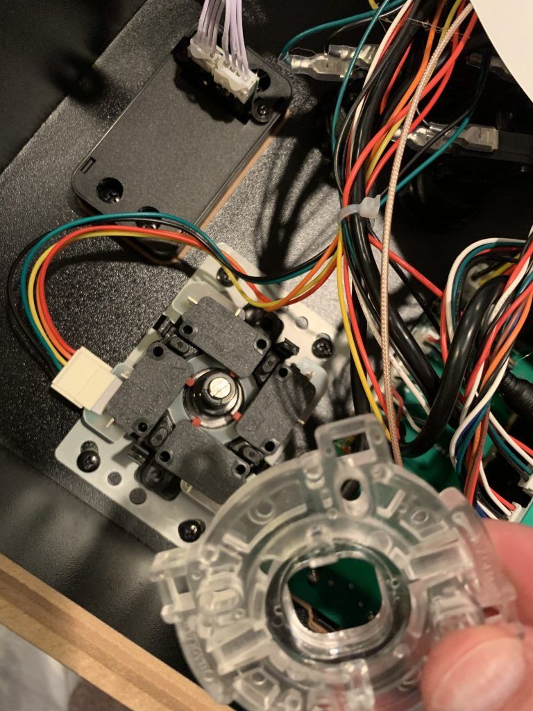 Push the black clips in and it's easy enough to pull it out.