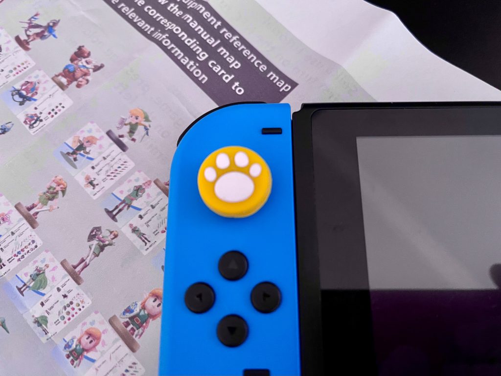 Not a fan of analog stick covers, but nice that it's there.