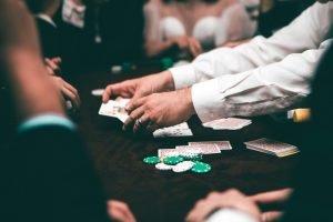 Dealer's hands dealing cards at a casino