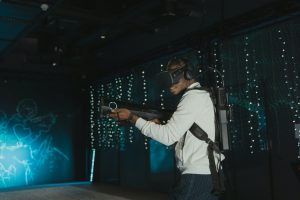 Gamer in full VR gear