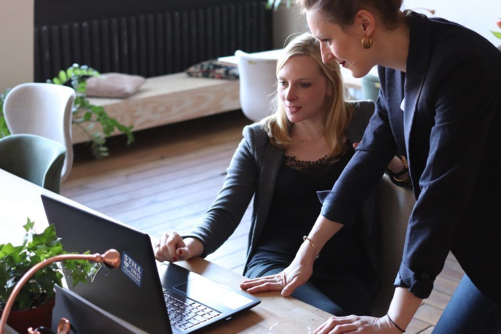 Two women collaborating at a computer