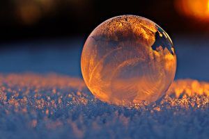 Orange ice ball on snow