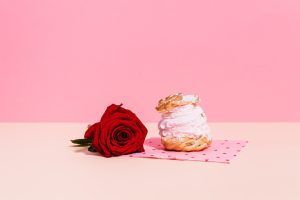 Pink Napoleon Cake and Red Rose on Pink Background