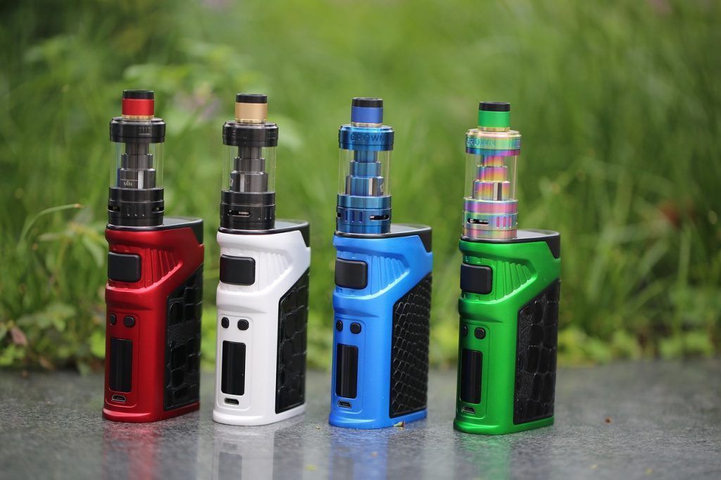 Red, white, blue, and green vape devices