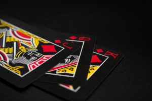 Black blackjack cards on a black background