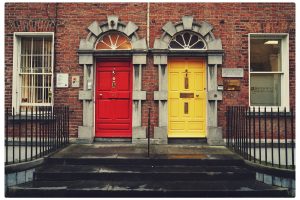 two yellow and red wooden doors in Dublin, Ireland