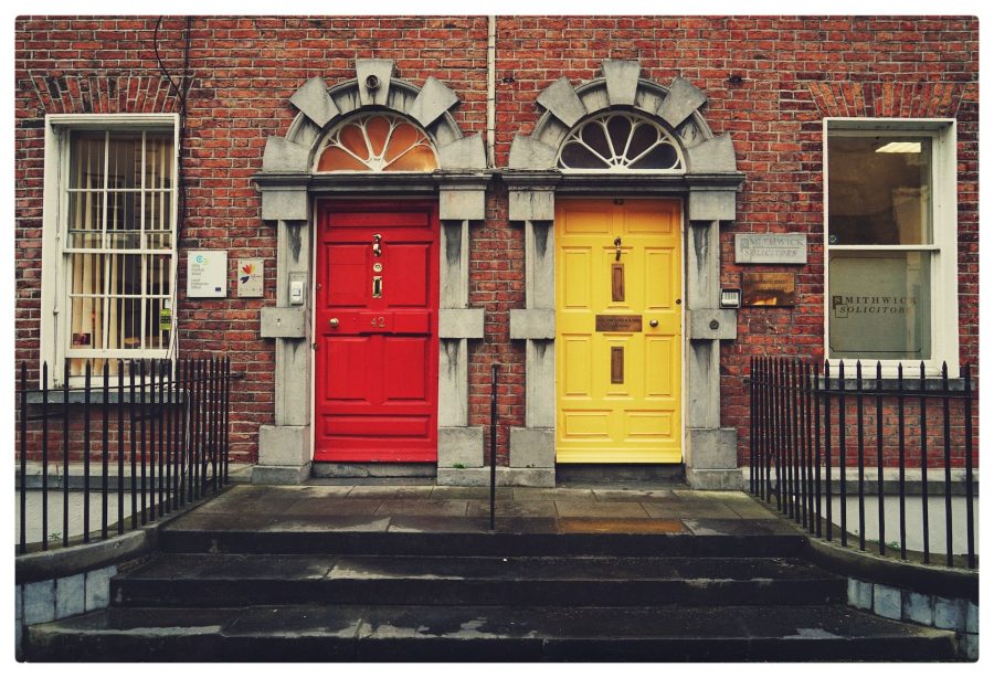 two yellow and red wooden doors in Dublin, Ireland
