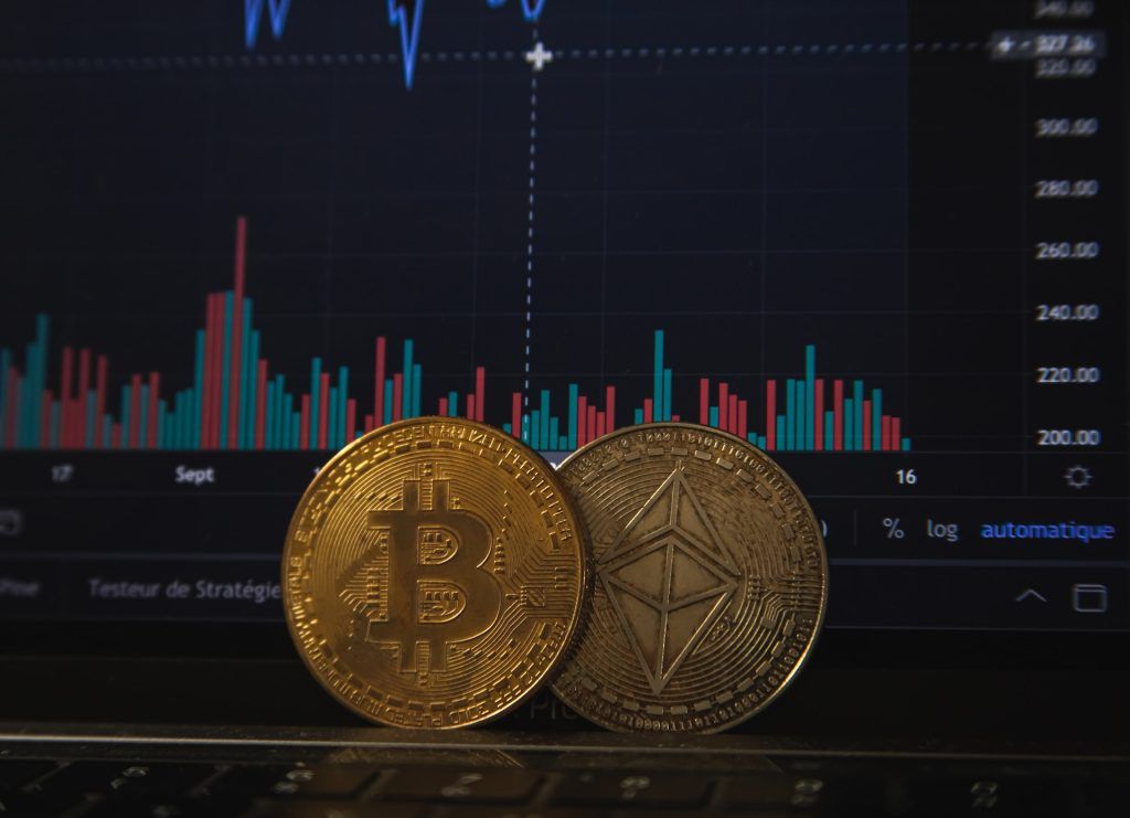 Physical bitcoin in front of stock stats