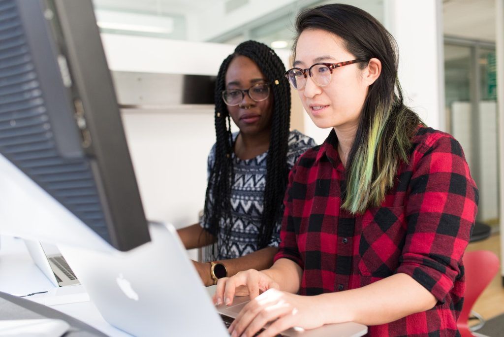 Two women in front of a computer