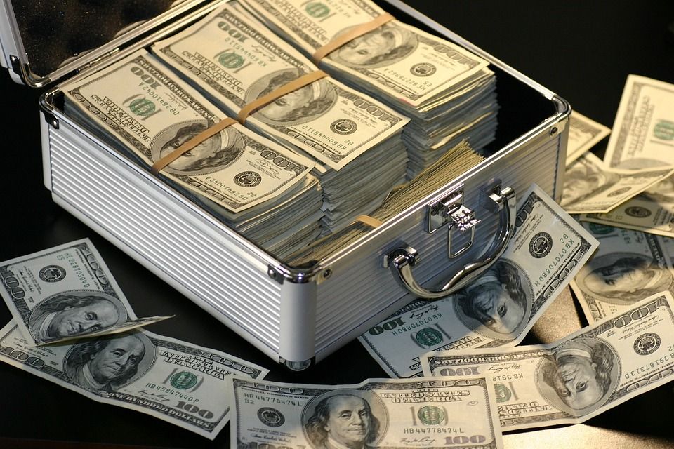 large amounts of US cash and a briefcase