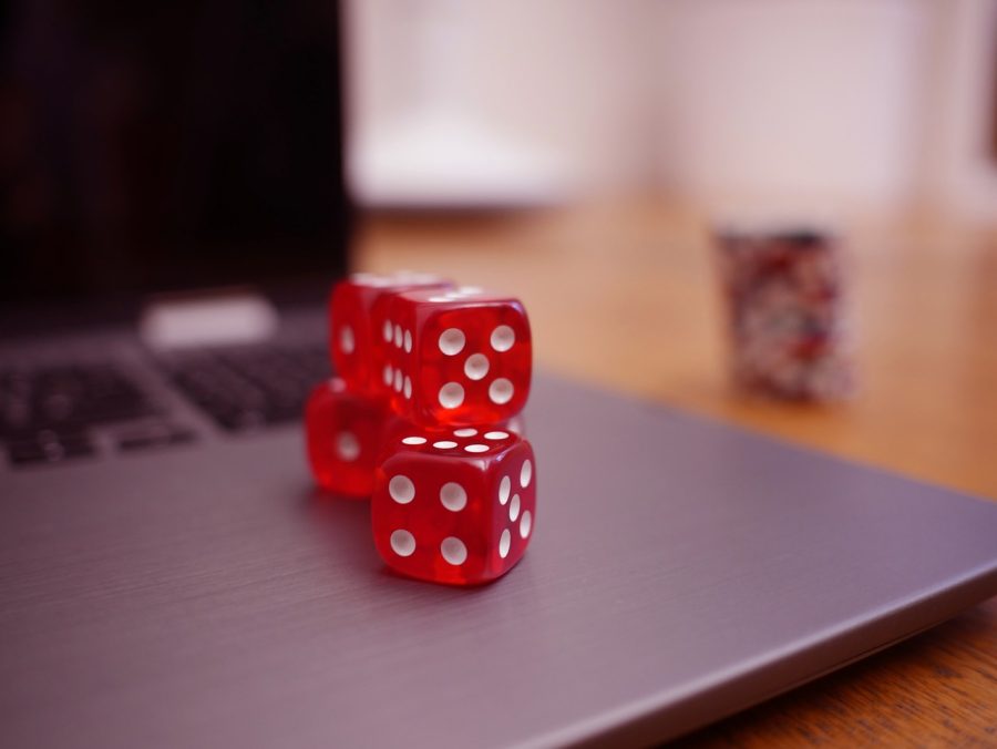 red dice on the corner of a laptop