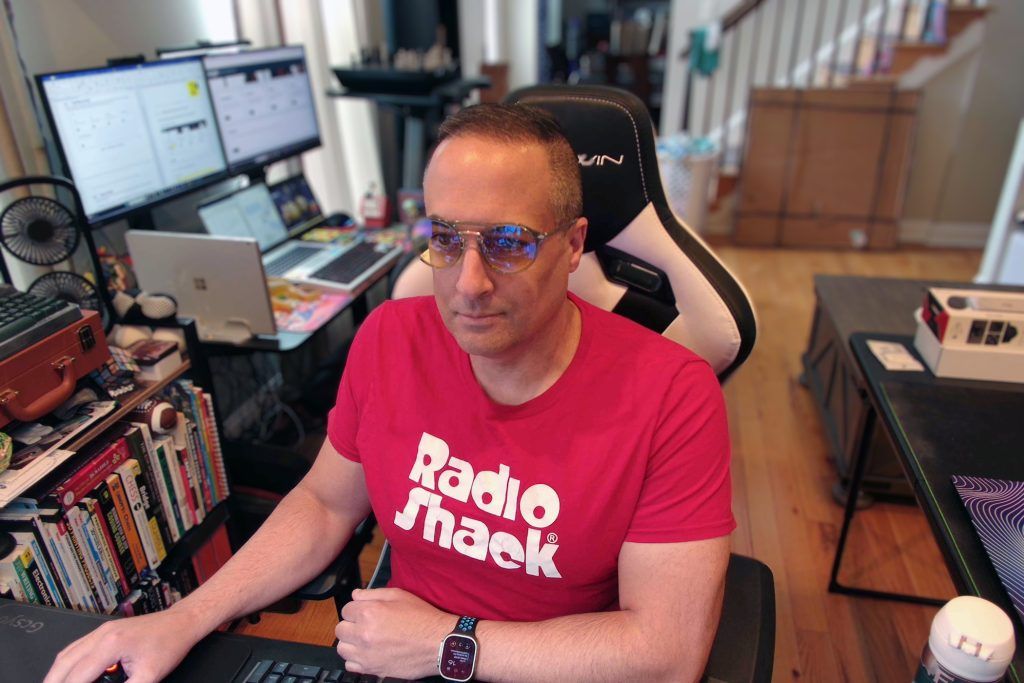 Man wearing Gunnar World of Warcraft, Alliance Edition glasses in front of a computer