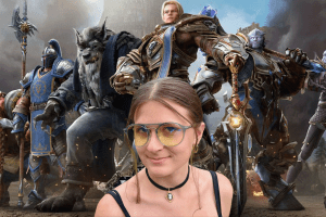 Gunnar World of Warcraft, Alliance Edition glasses worn by a young woman in front of a FOR THE ALLIANCE backdrop