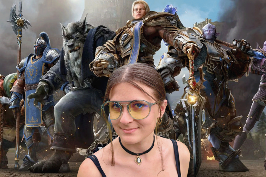 Gunnar World of Warcraft, Alliance Edition glasses worn by a young woman in front of a FOR THE ALLIANCE backdrop