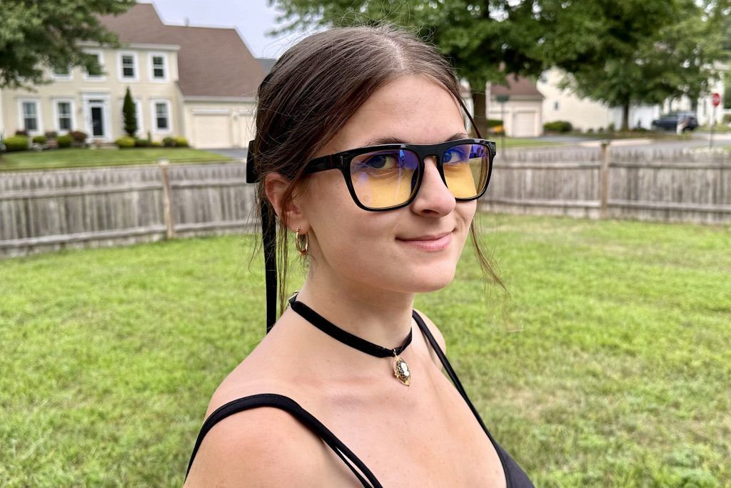 young woman wearing Gunnar World of Warcraft, Horde Edition Premium Gaming Glasses outdoors