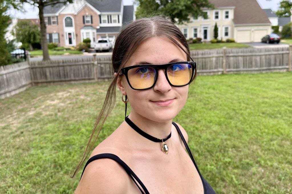 young woman wearing Gunnar World of Warcraft, Horde Edition Premium Gaming Glasses outdoors