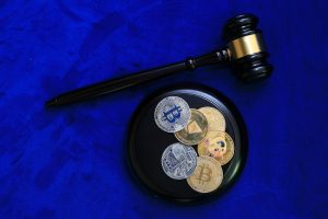 overhead view of gavel and physical bitcoins