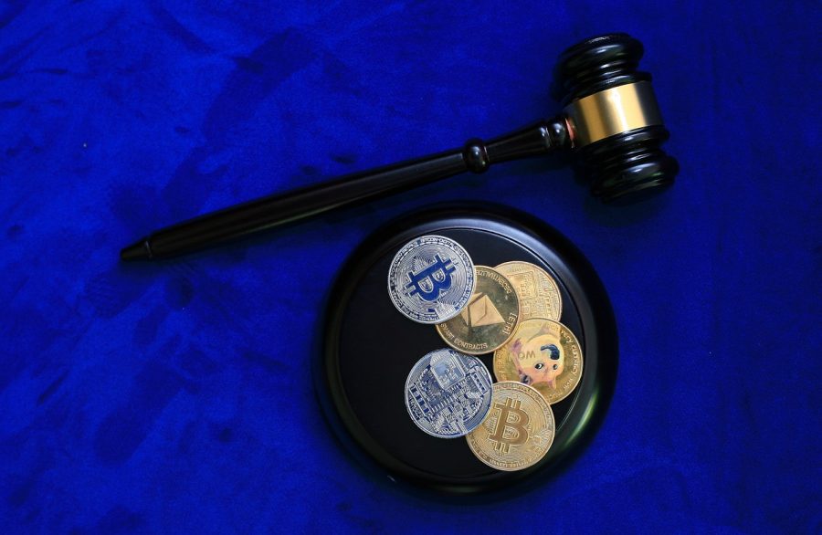 overhead view of gavel and physical bitcoins