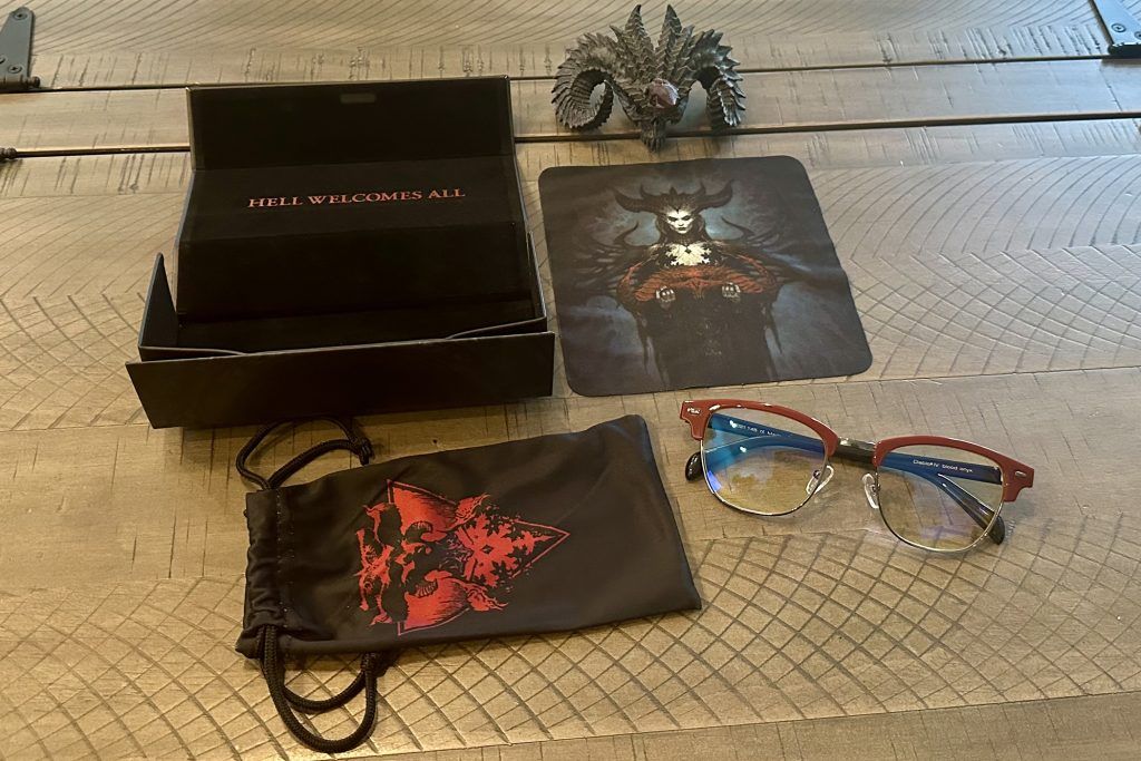 Diablo IV Sanctuary Edition Blood-Onyx Amber Glasses package on a tabletop