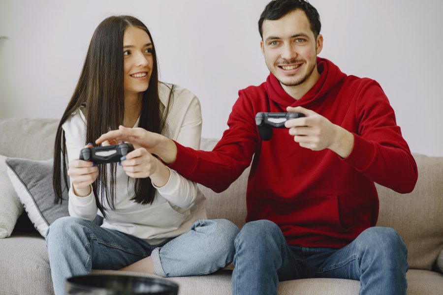 Couple at home playing video games