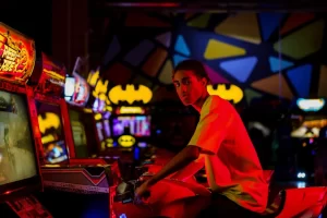 Young man in a classic arcade setting.