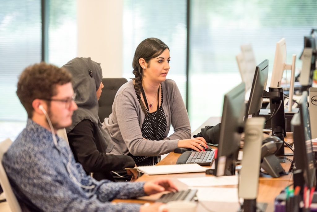 Employees collaborating and strategizing to develop customized sales approaches specifically designed for their target accounts.