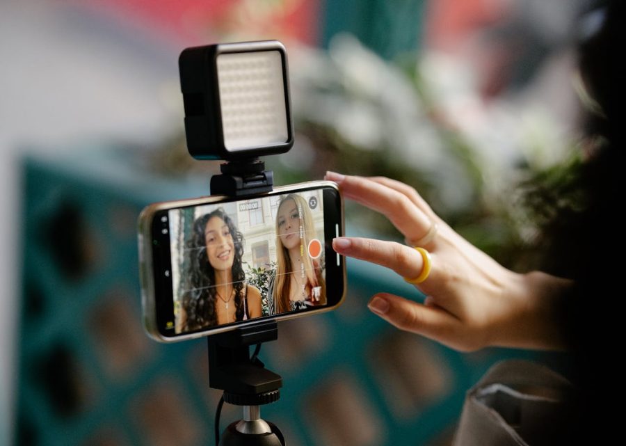 Woman Using Smartphone for Recording