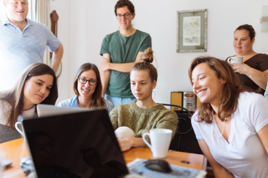 students looking at laptop computer