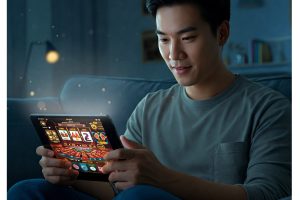 man enjoying an online casino on their transparent tablet - Generated with AI
