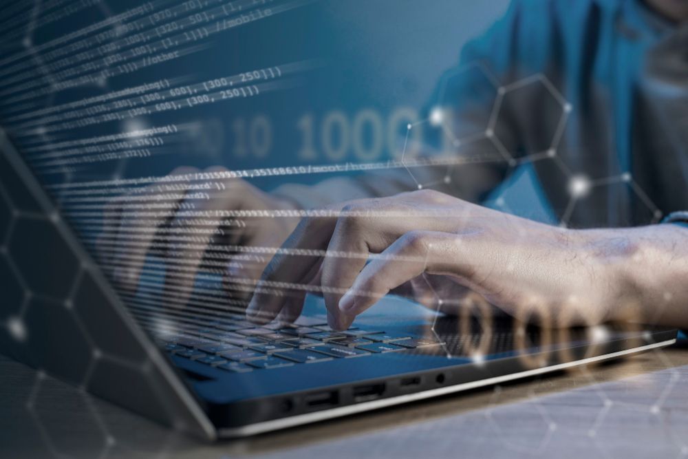 HTML and CSS collage concept with close-up of hands on laptop
