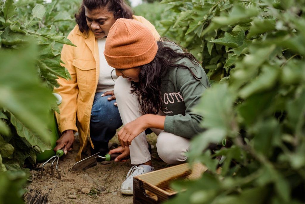 grandmother and granddaughter tending to a garden