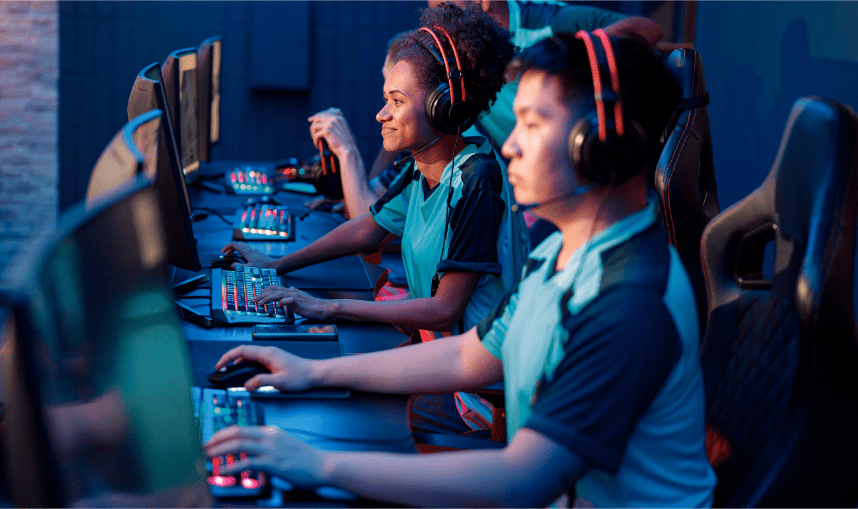 Competitive esports gamers in front of PCs