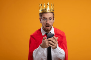 man in a royal costume looking at his smartphone in amazement
