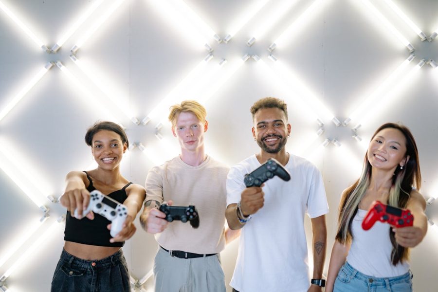 Group of Friends Smiling while Holding Game Controllers