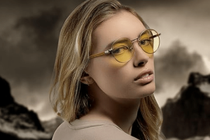 Blonde woman modeling Gunnar x The Witcher Gaming and Computer Glasses.