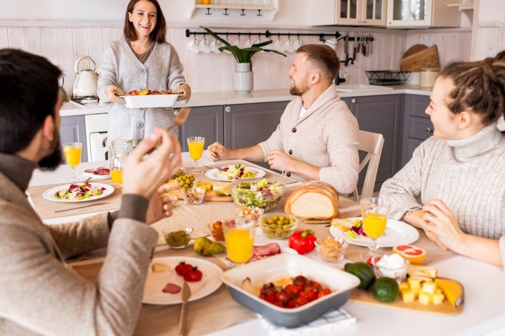 four people enjoying a homemade meal together