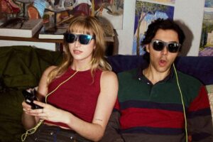 Woman and man using X By XREAL a01+ AR Glasses.
