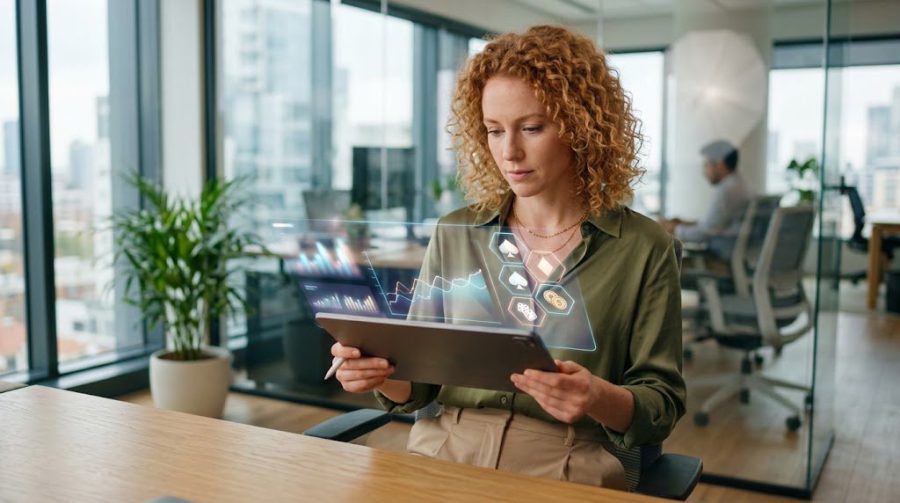 Professional working on digital platform management and dual-currency data analytics in a modern tech workspace.